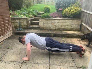 Nathan doing a press up on his patio