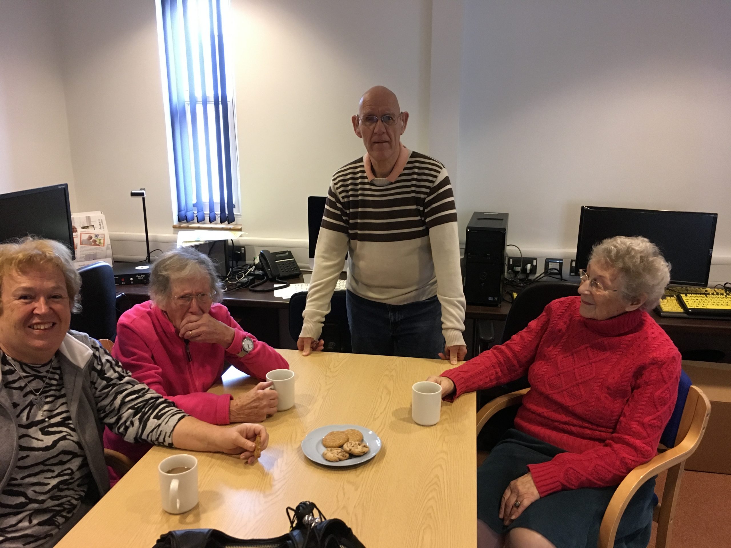 A group of VI people at a coffee morning