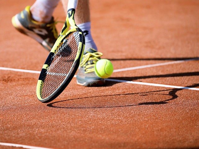 an action shot close up of a person hitting a ball with a racquet