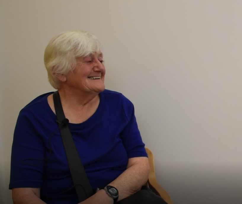 Mary sitting and smiling