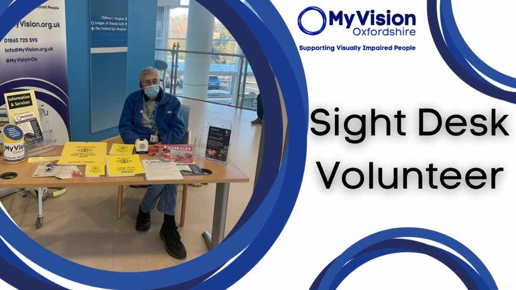 Our sight desk with our volunteer Ian sitting at it, the poster has circle designs over the page and a title that says, 'Sight Desk Volunteer.'